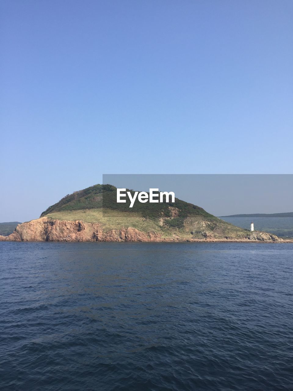 VIEW OF CALM SEA AGAINST CLEAR SKY