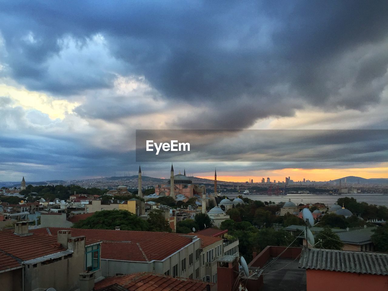 High angle view of townscape against cloudy sky