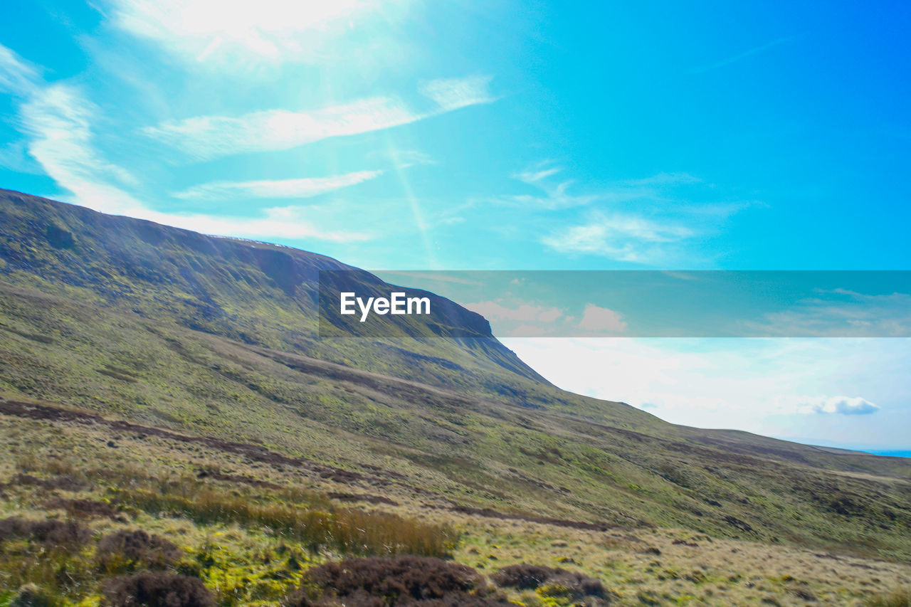 SCENIC VIEW OF MOUNTAIN AGAINST SKY