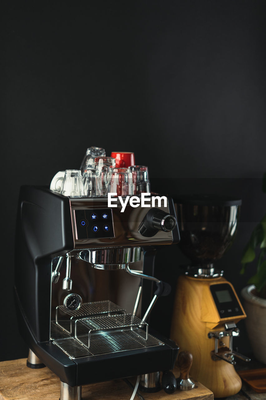 CLOSE-UP OF COFFEE ON TABLE AT HOME