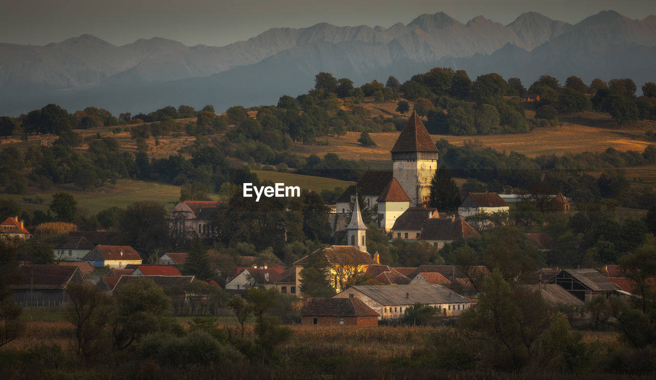 Moments before sunset with hosman village near sibiu and fagaras mountains in background.