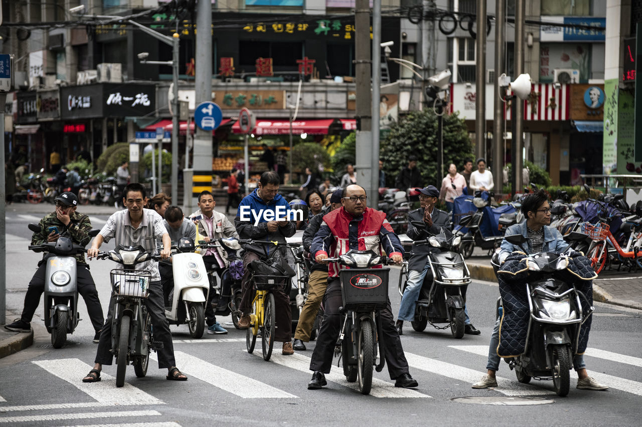 PEOPLE ON STREET IN CITY