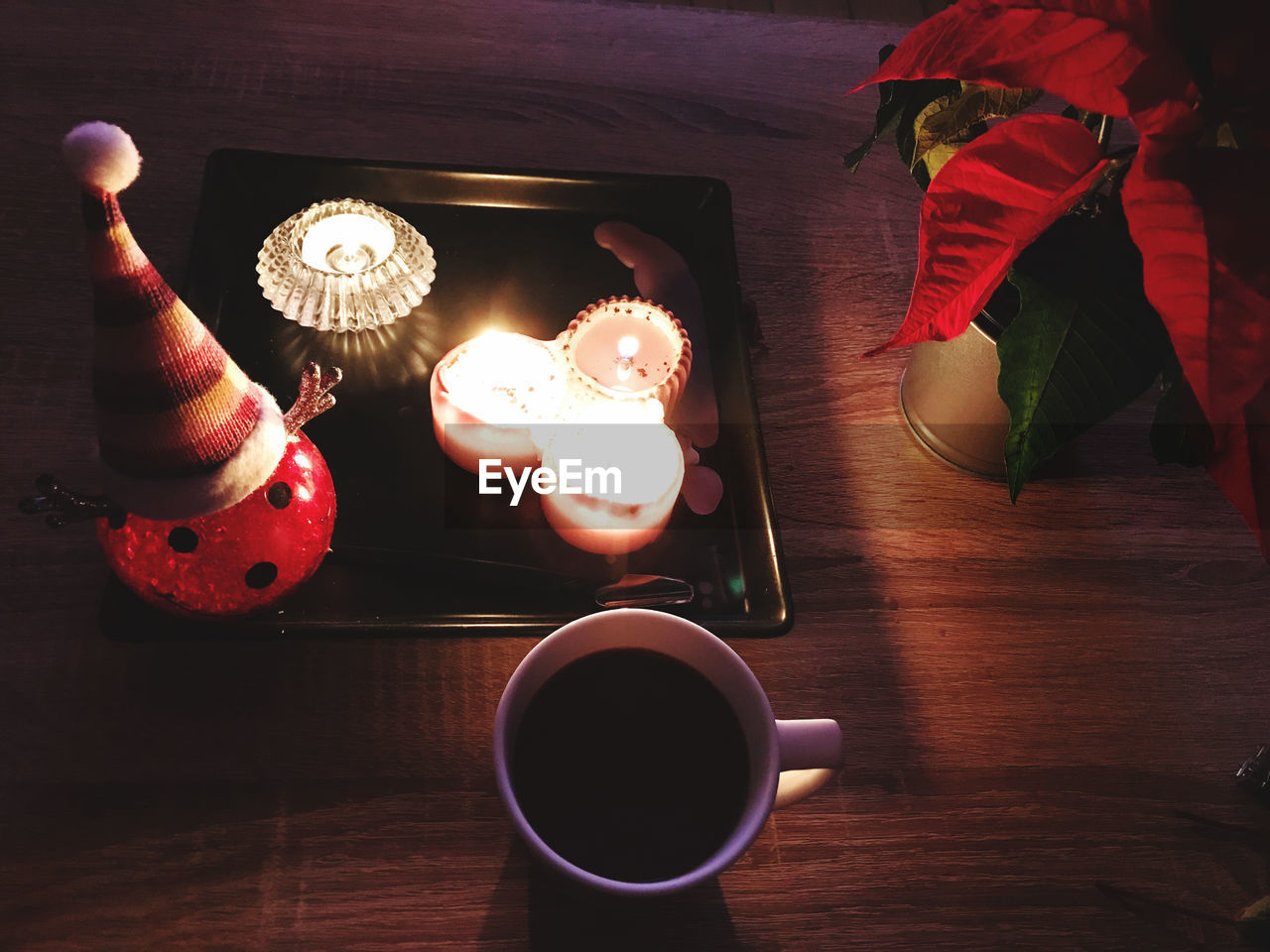 food and drink, table, drink, red, cup, food, mug, refreshment, wood, indoors, freshness, coffee, coffee cup, sweet food, high angle view, lighting, no people, still life, hot drink, light, sweet, baked, flower, tea, dessert, crockery, healthy eating, directly above, tableware