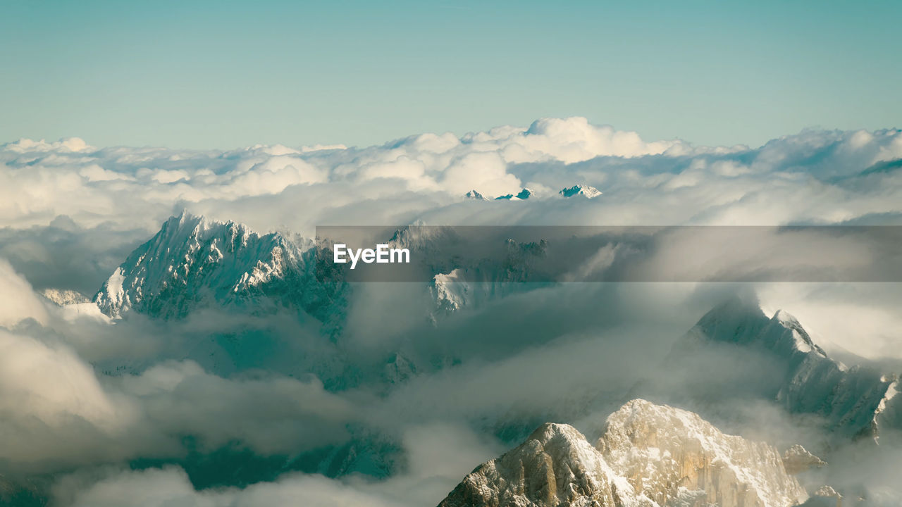 Scenic view of snowcapped mountains against sky