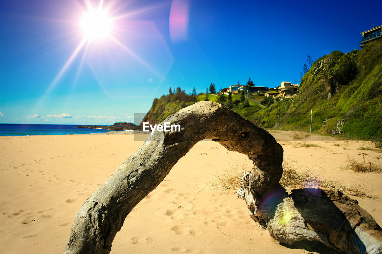 Scenic view of sea against clear sky on sunny day