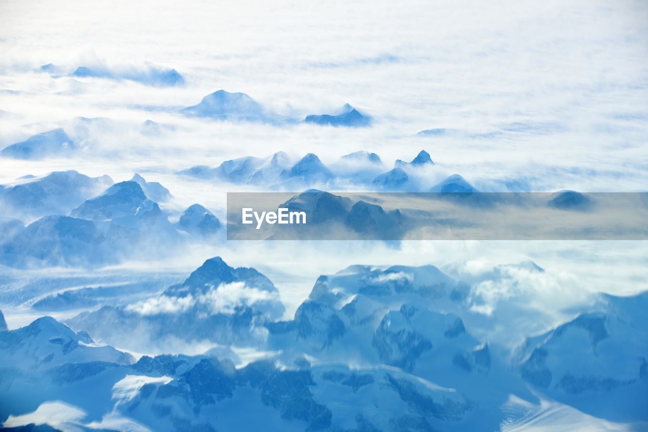 SCENIC VIEW OF SNOW MOUNTAINS AGAINST SKY