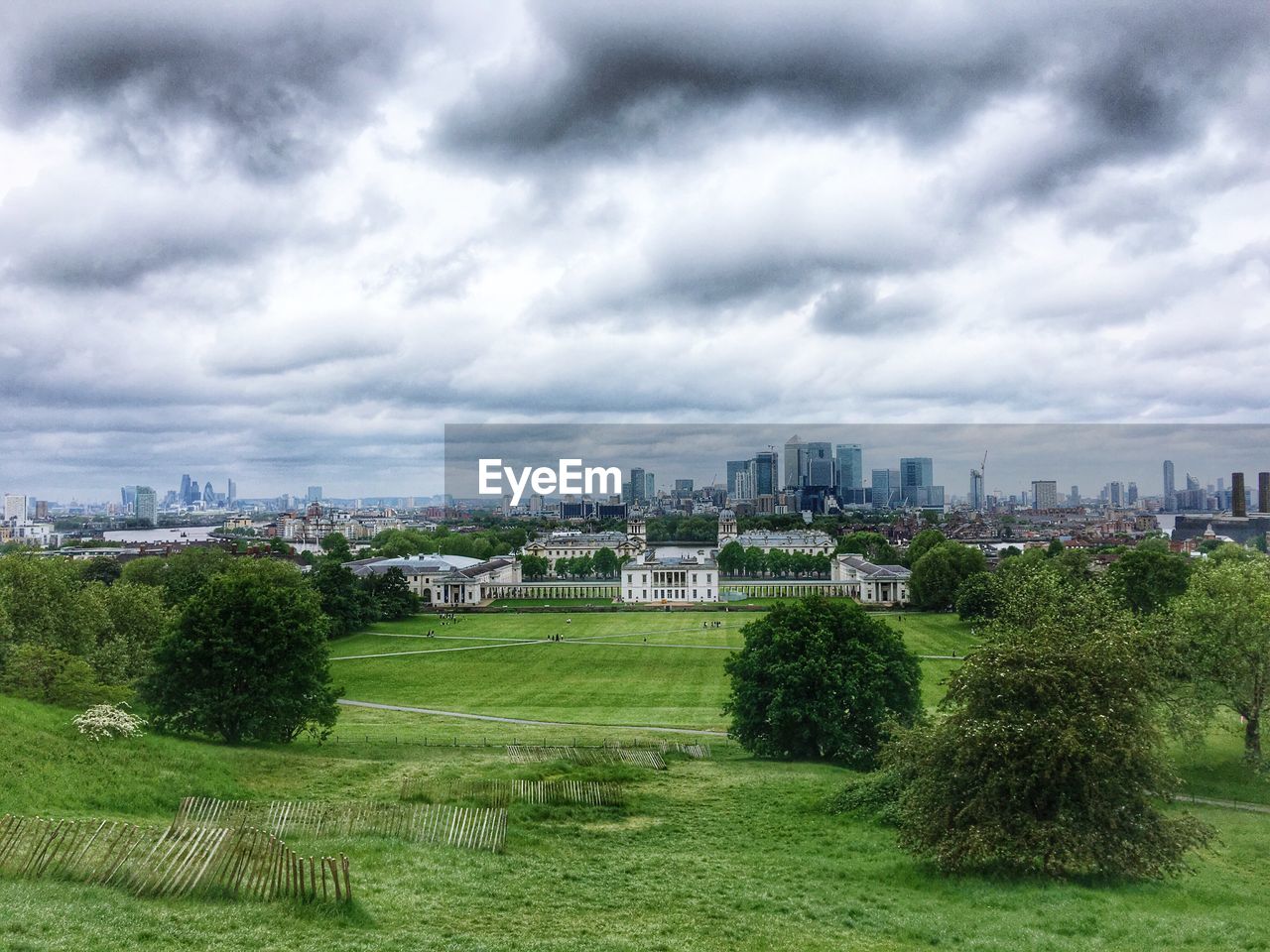 VIEW OF CITY AGAINST CLOUDY SKY