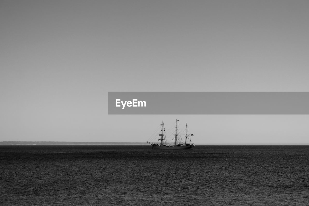 Distance shot of boat in calm sea