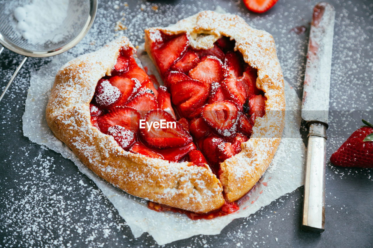 High angle view of strawberry tart on table