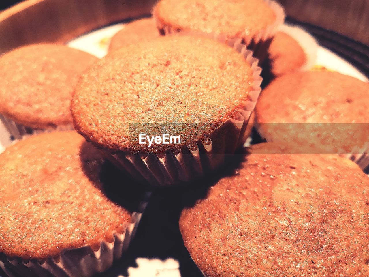 CLOSE-UP OF CUPCAKES ON CAKE