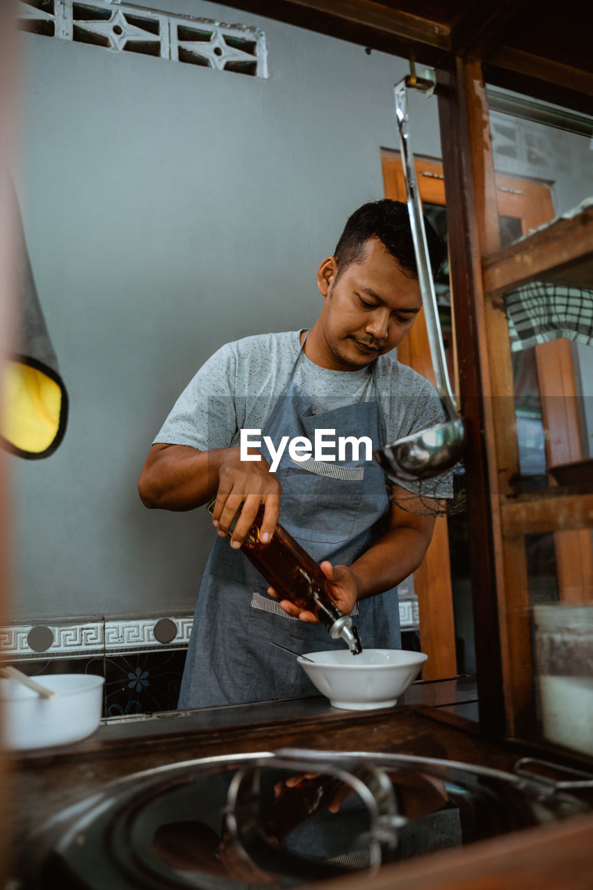 portrait of young man working in gym