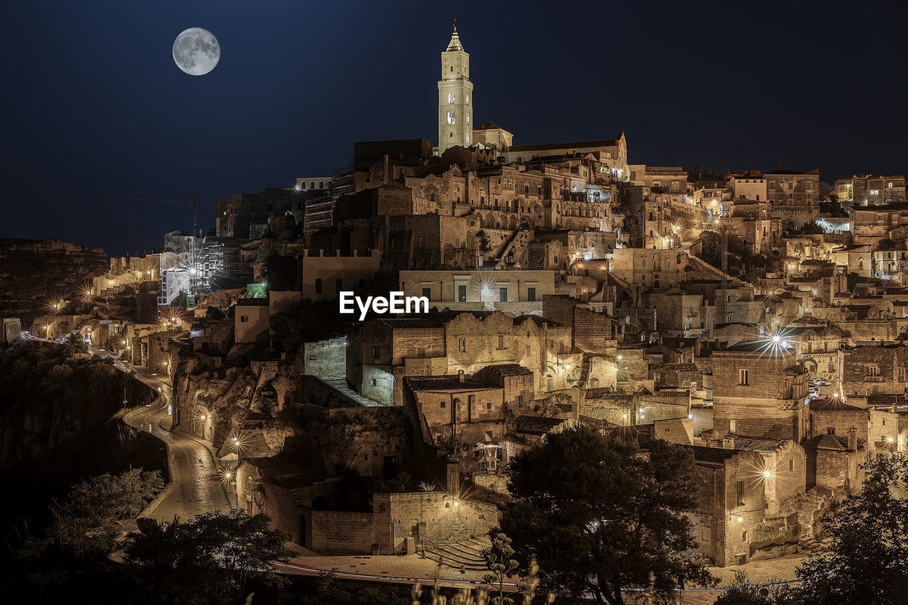 High angle view of illuminated buildings in city at night