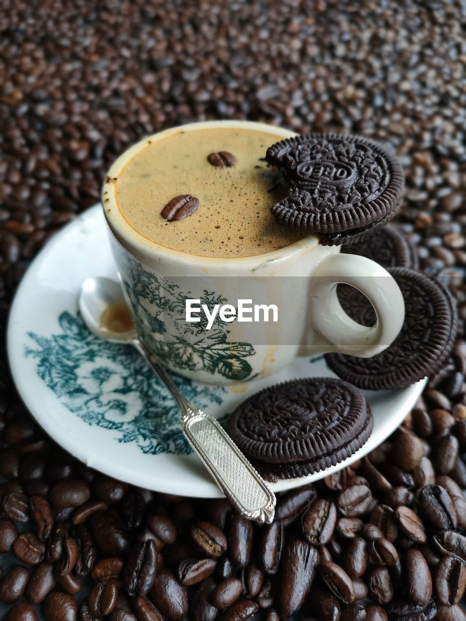 HIGH ANGLE VIEW OF COFFEE CUP AND COOKIES