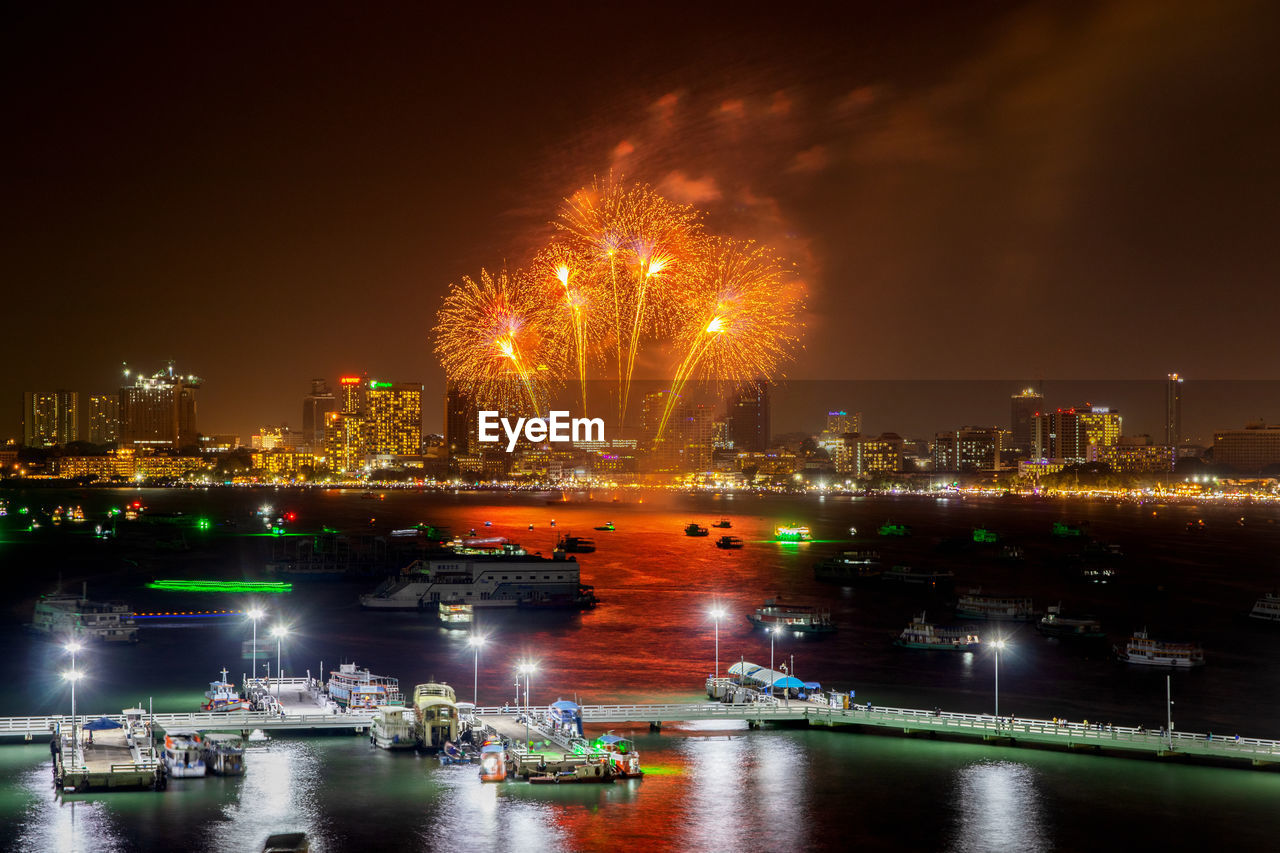 Colorful fireworks display over the night sky of the city during a festival