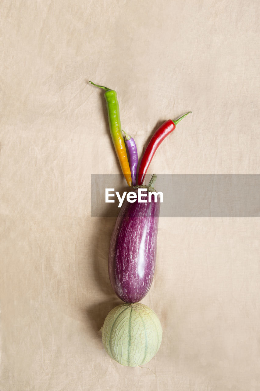 Fresh fruit and vegetables on beige background
