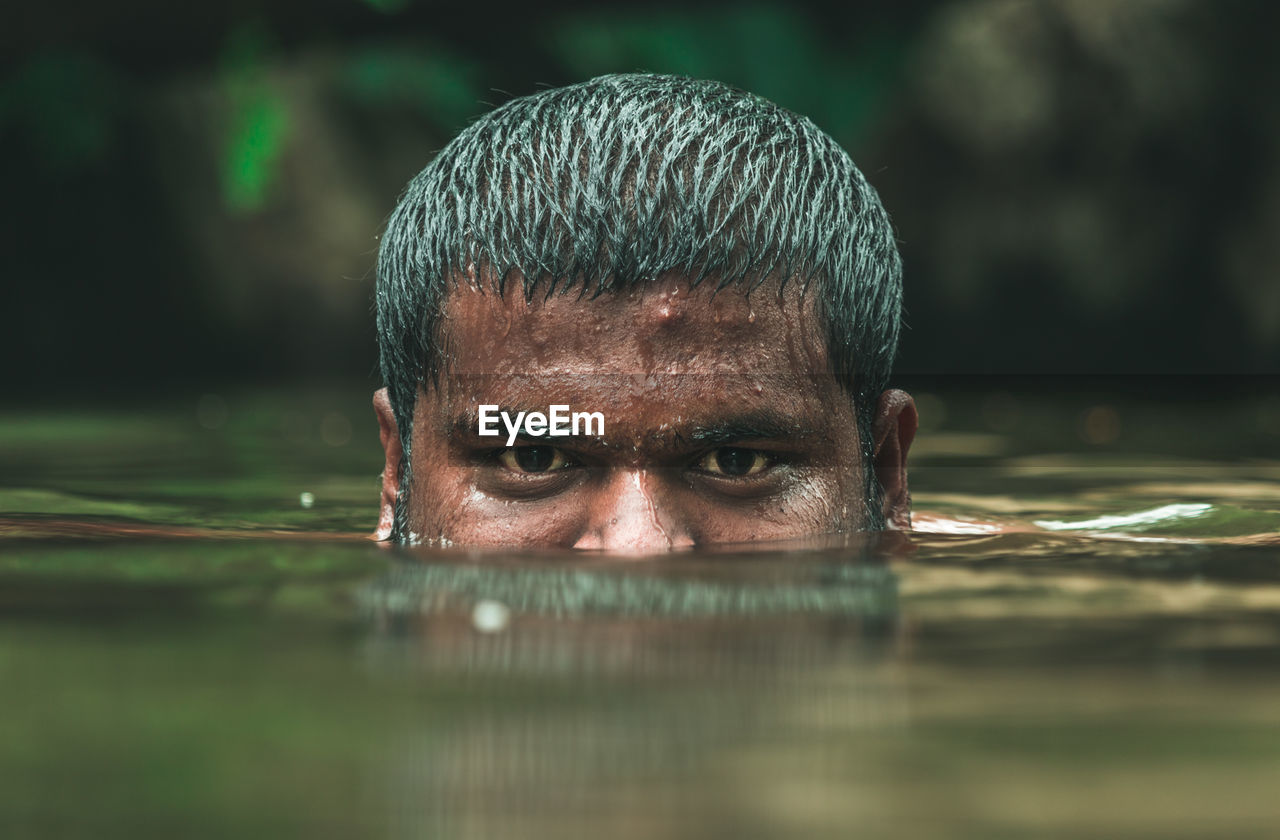 CLOSE-UP PORTRAIT OF MAN WITH REFLECTION