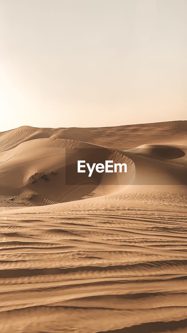 Scenic view of desert against clear sky