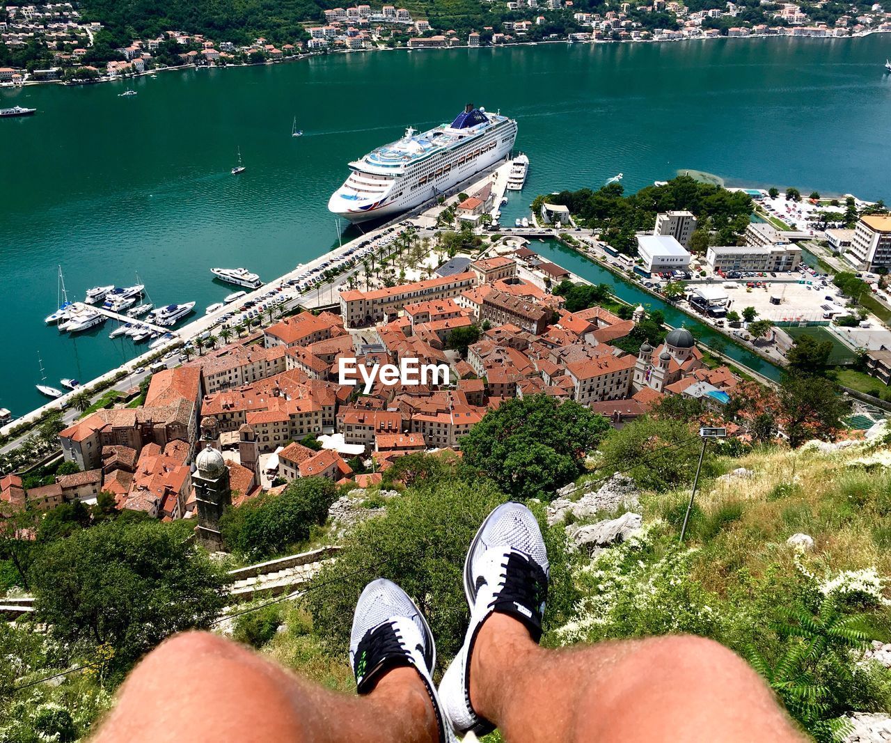 LOW SECTION OF WOMAN STANDING ON RAILING