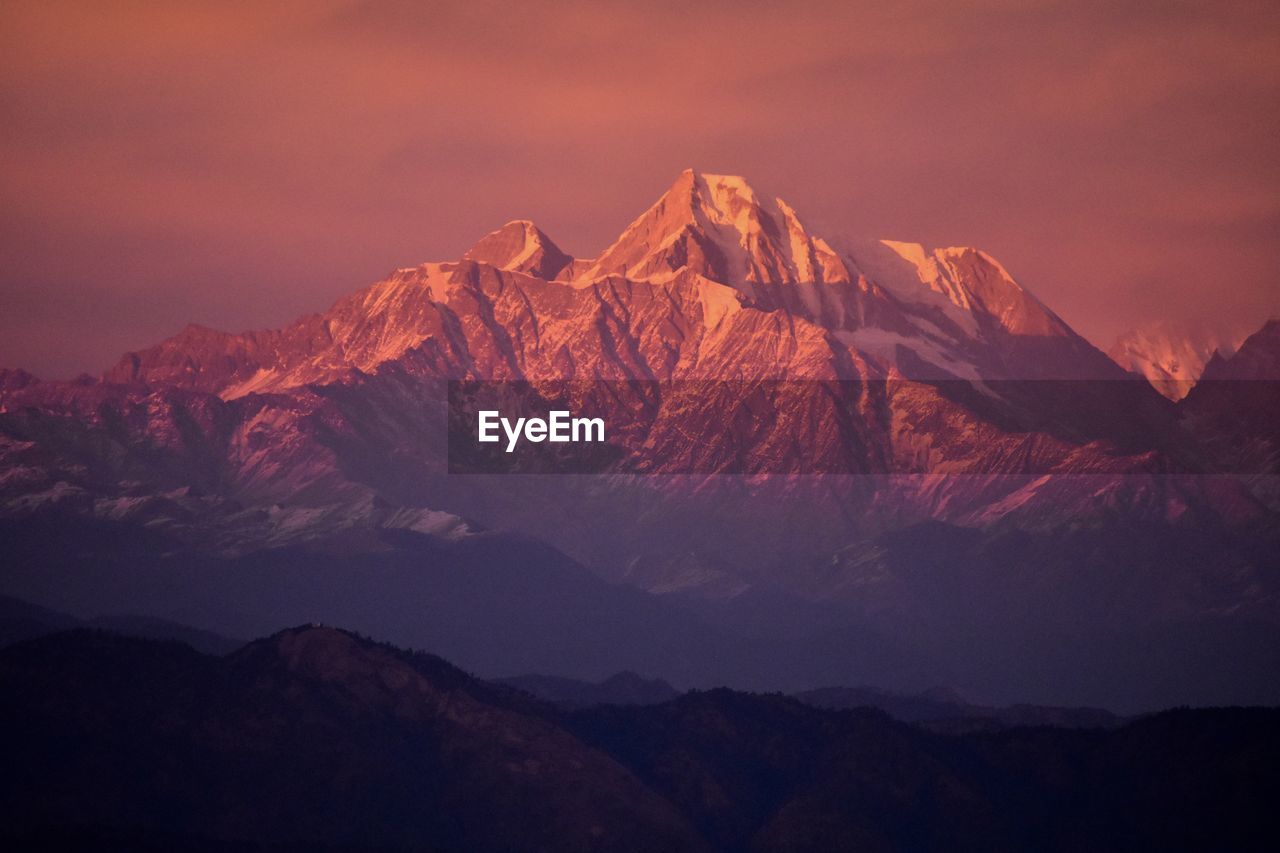 Scenic view of mountains against sky during sunset