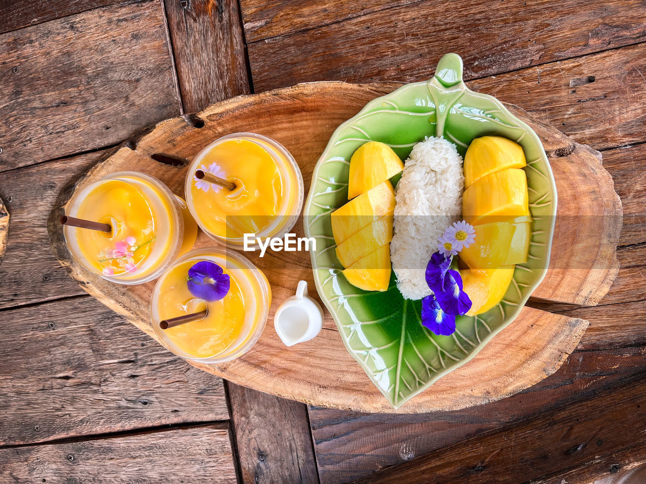 food and drink, food, wood, healthy eating, freshness, wellbeing, fruit, yellow, high angle view, produce, table, no people, citrus fruit, slice, still life, directly above, indoors, lemon, refreshment, flower, plate, nature, multi colored, bowl