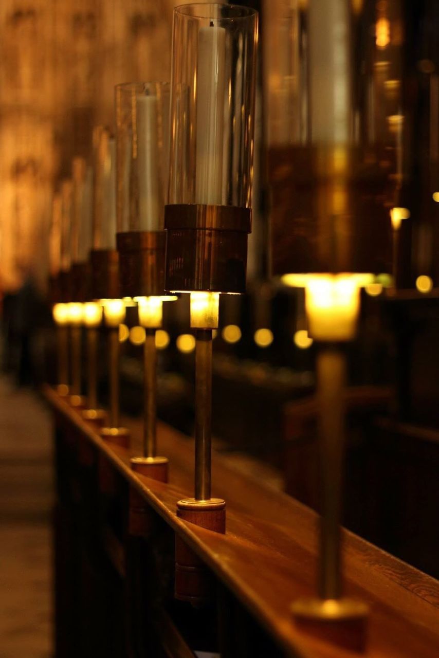 Close-up of lit lamps in a row