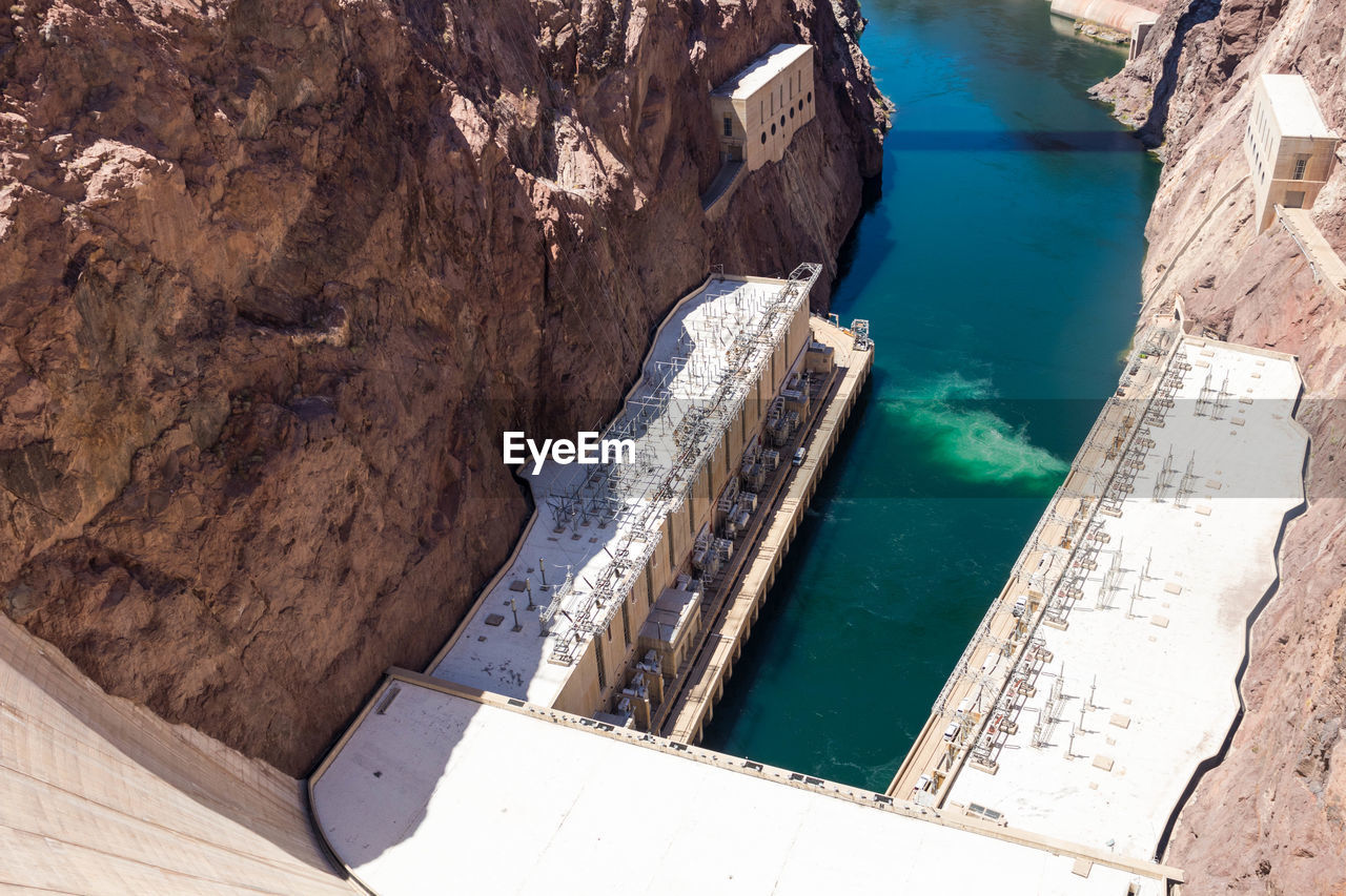 HIGH ANGLE VIEW OF DAM ON ROCK