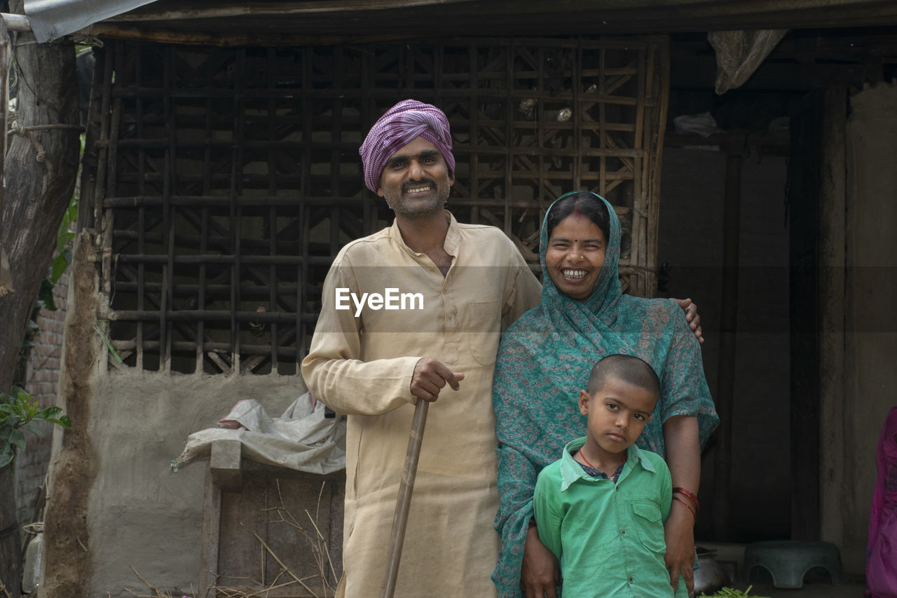 Portrait of a smiling young family of farmer