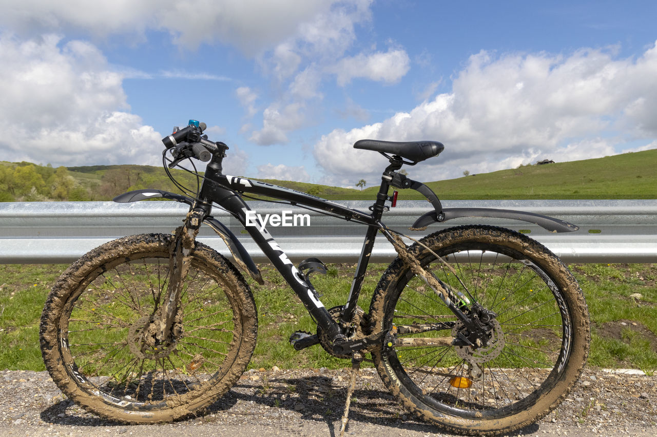 BICYCLE PARKED ON LAND