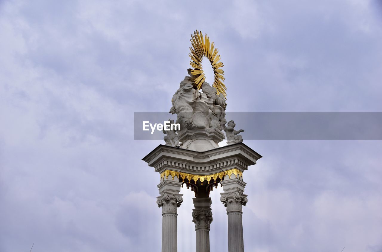 sky, architecture, cloud, sculpture, travel destinations, statue, landmark, built structure, nature, history, no people, the past, city, travel, monument, low angle view, day, tourism, architectural column, craft, outdoors, religion, representation, tower, building exterior, gold, belief, human representation, building, memorial