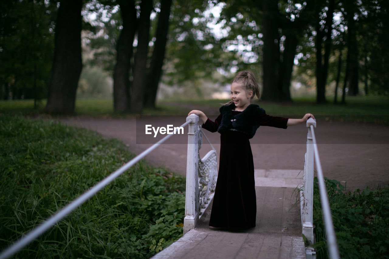 Beautiful little child girl walking in a park