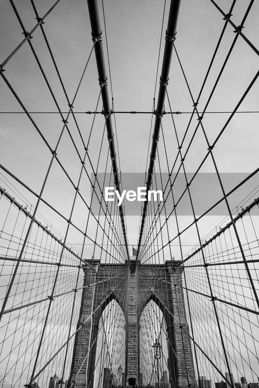 architecture, built structure, black and white, monochrome, bridge, sky, monochrome photography, transportation, line, engineering, city, suspension bridge, travel destinations, low angle view, travel, nature, tourism, building exterior, day, outdoors, cloud, arch, metal, steel cable, pattern, cable-stayed bridge, cable, black