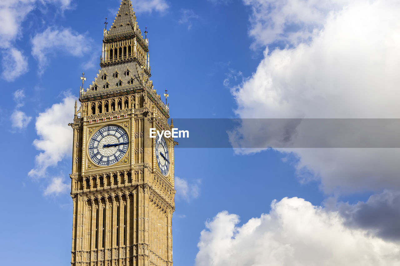 low angle view of clock tower against sky