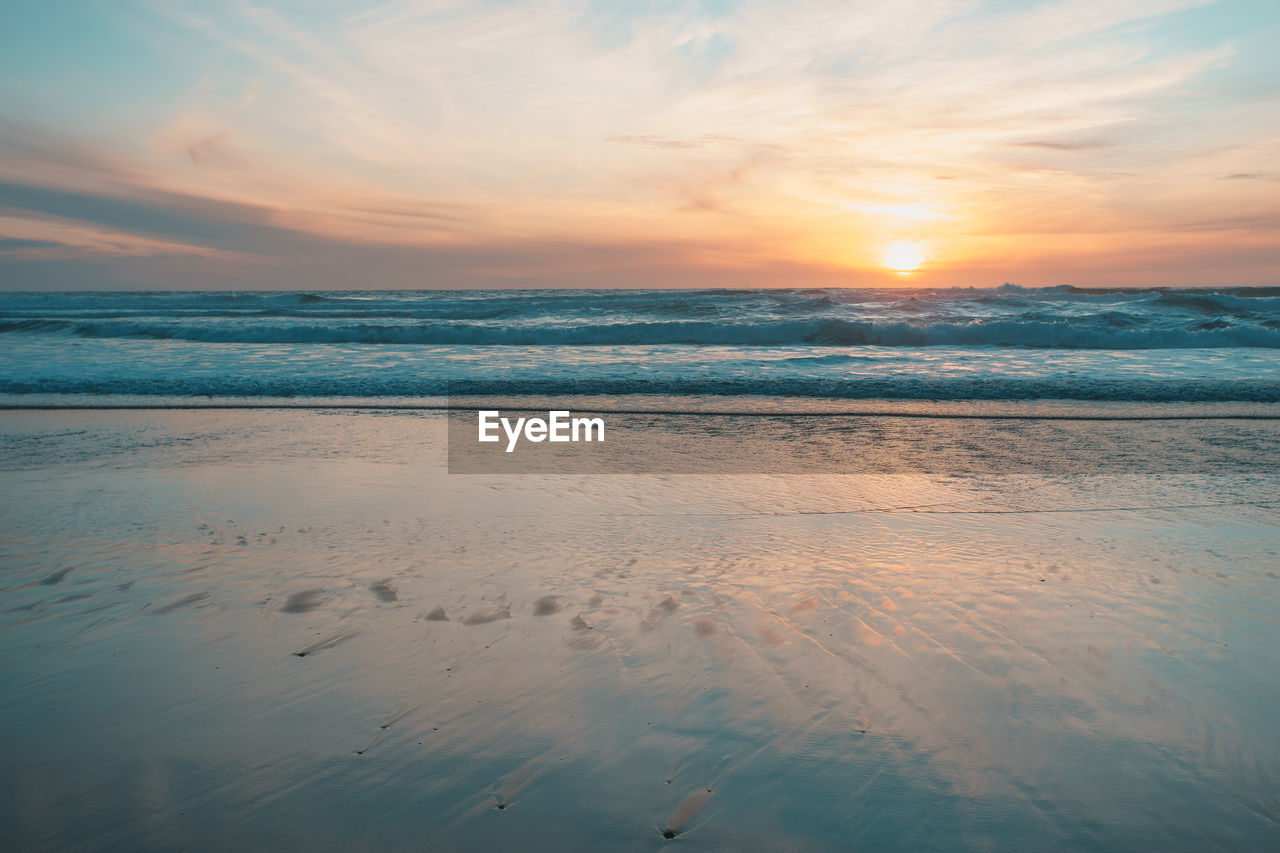 Scenic view of sea against sky during sunset