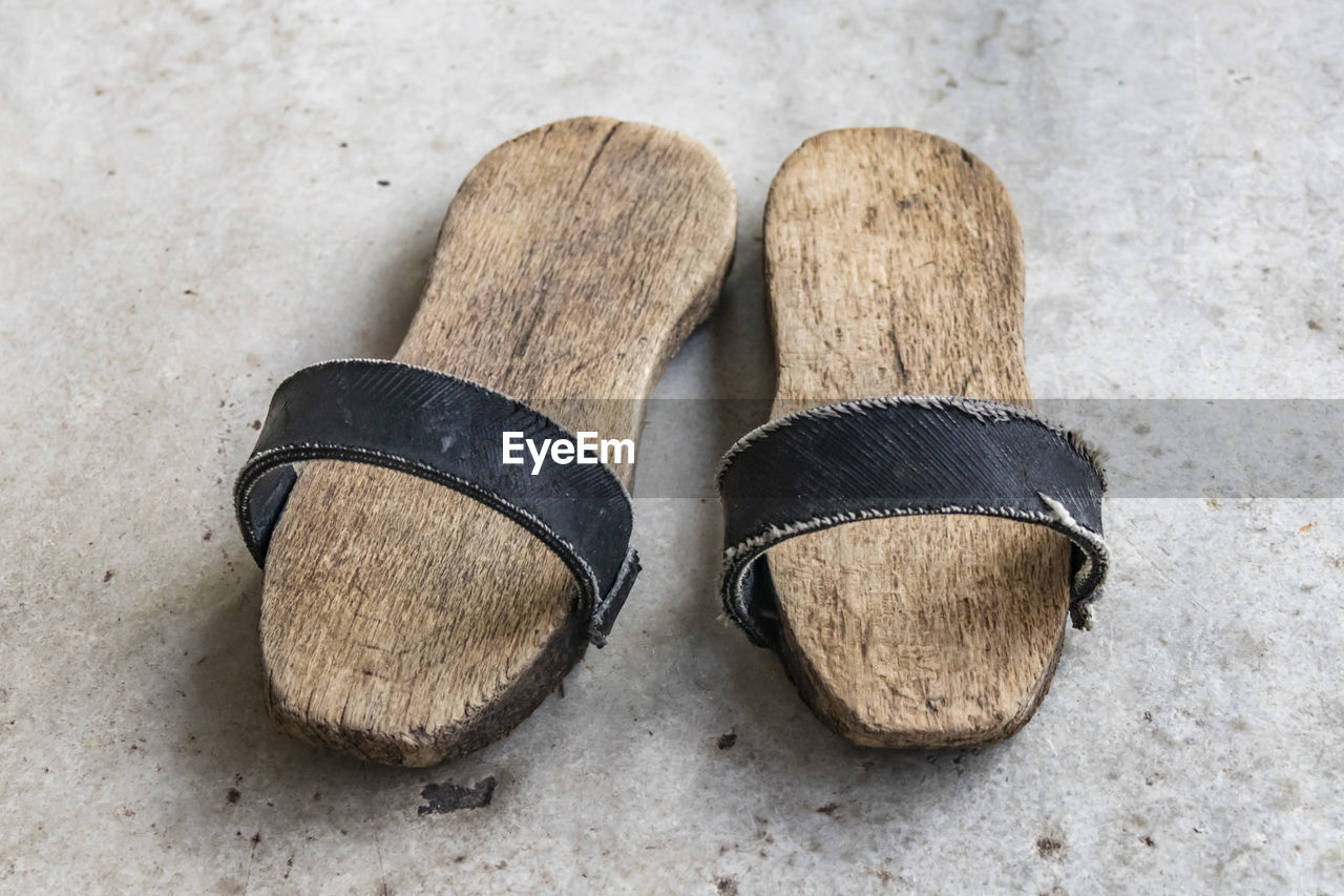 A pair of clogs for turkish bath.shoes with a thick wooden sole.