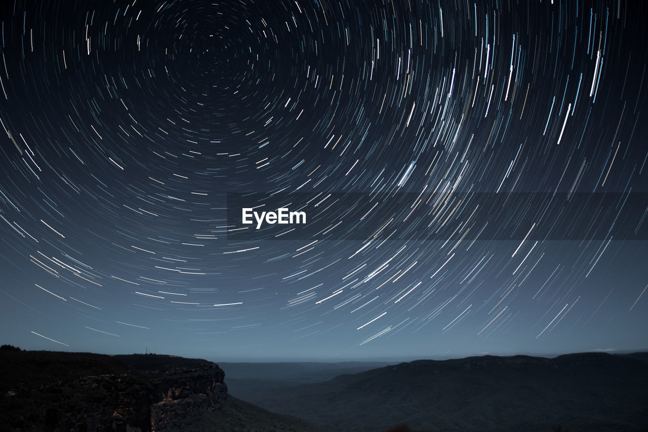 Scenic view of star field against sky at night