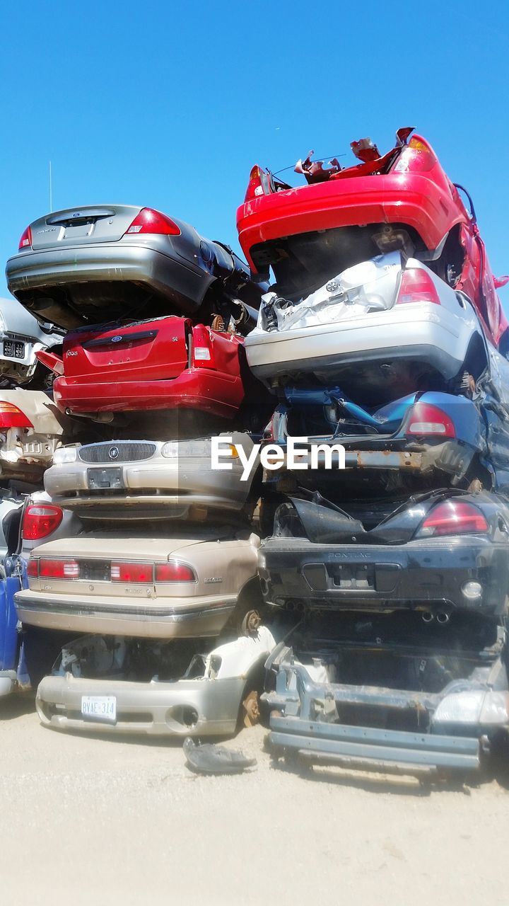 CLOSE-UP OF RED CAR ON ROAD