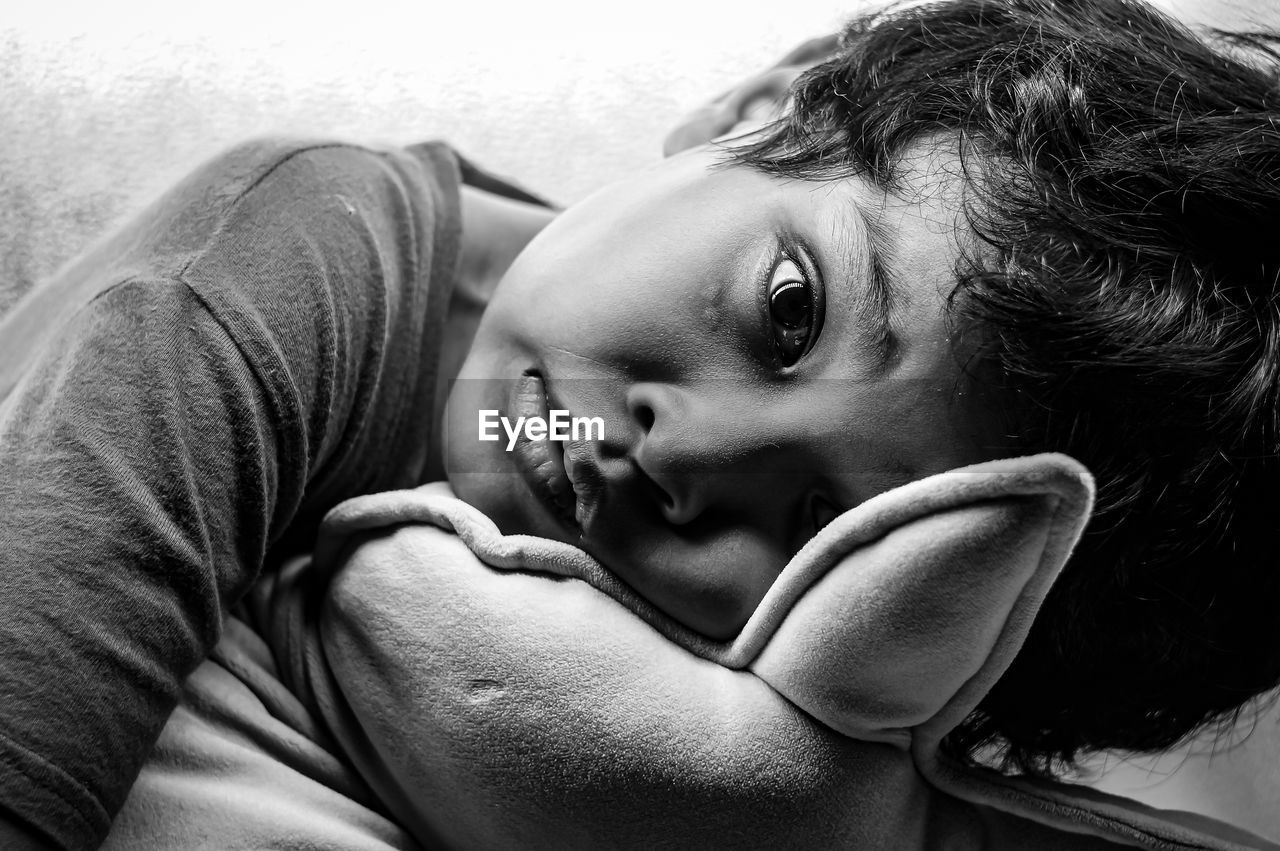 Close-up of young boy portrait in black and white