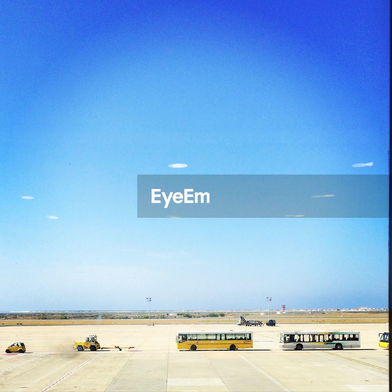 AIRPLANE ON RUNWAY AGAINST SKY