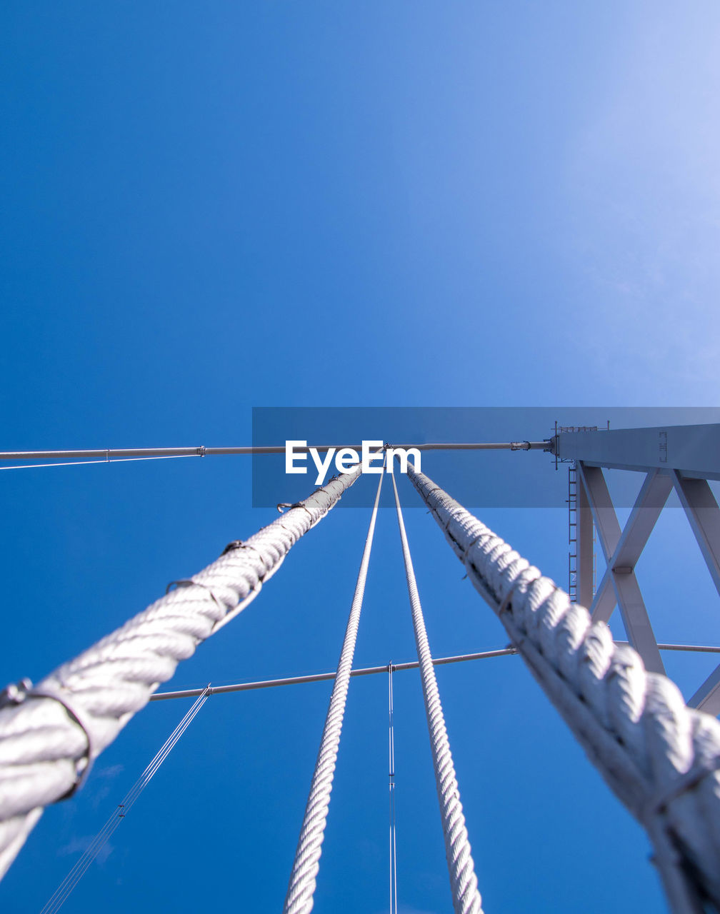 LOW ANGLE VIEW OF BRIDGE AGAINST CLEAR SKY