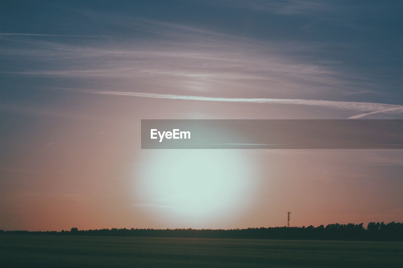 SCENIC VIEW OF LANDSCAPE AGAINST SKY DURING SUNSET