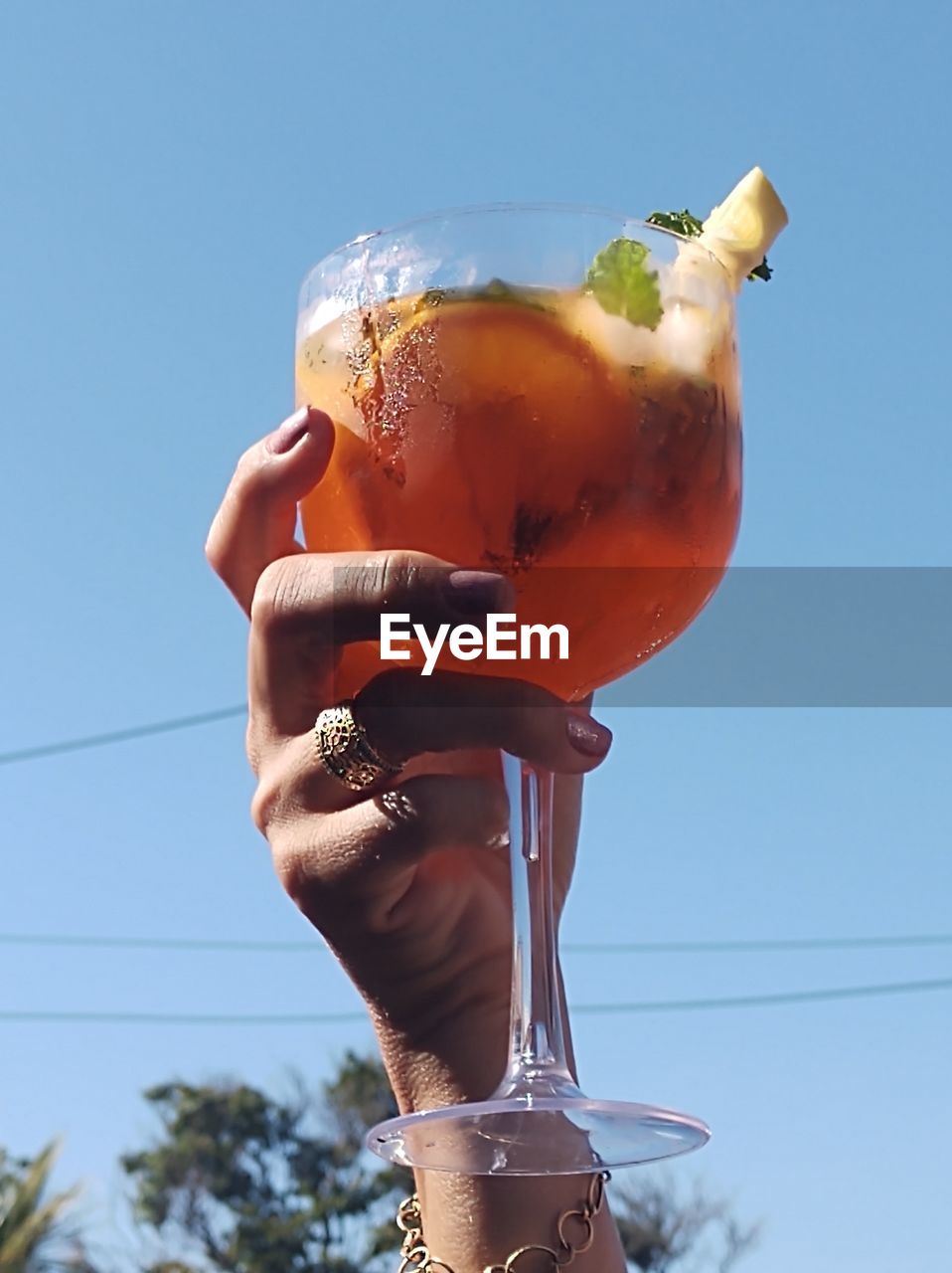 MIDSECTION OF MAN HOLDING ICE CREAM