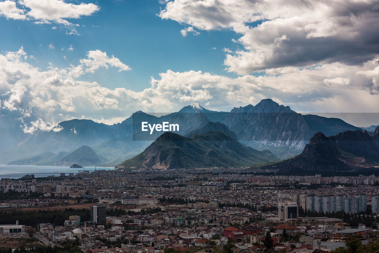 TOWNSCAPE AGAINST MOUNTAINS