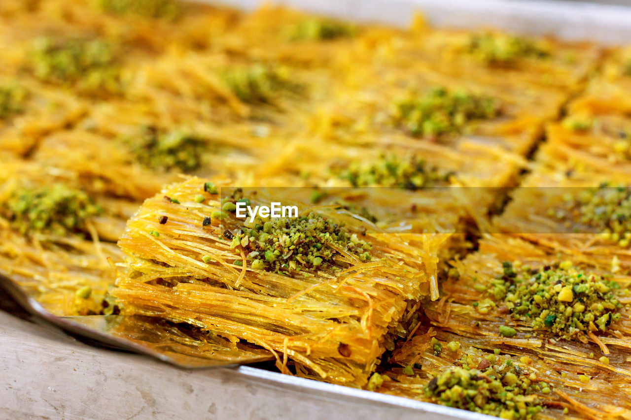 Traditional turkish desserts baklava and lokum in open buffet restaurant at hotel 