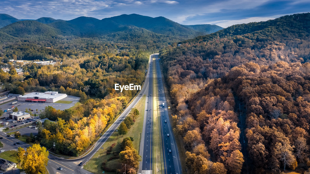 High angle view of road amidst trees during autumn