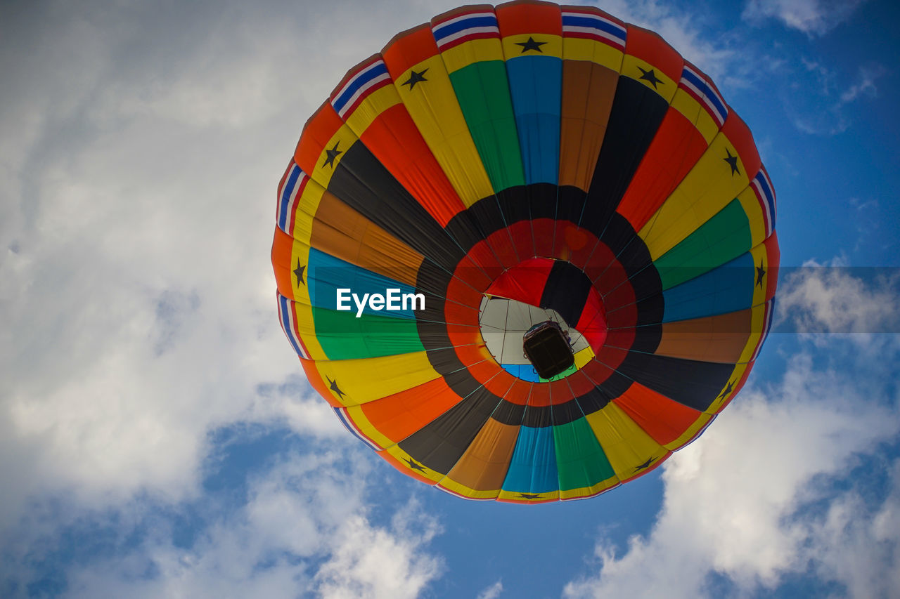 Low angle view of hot air balloon flying against sky