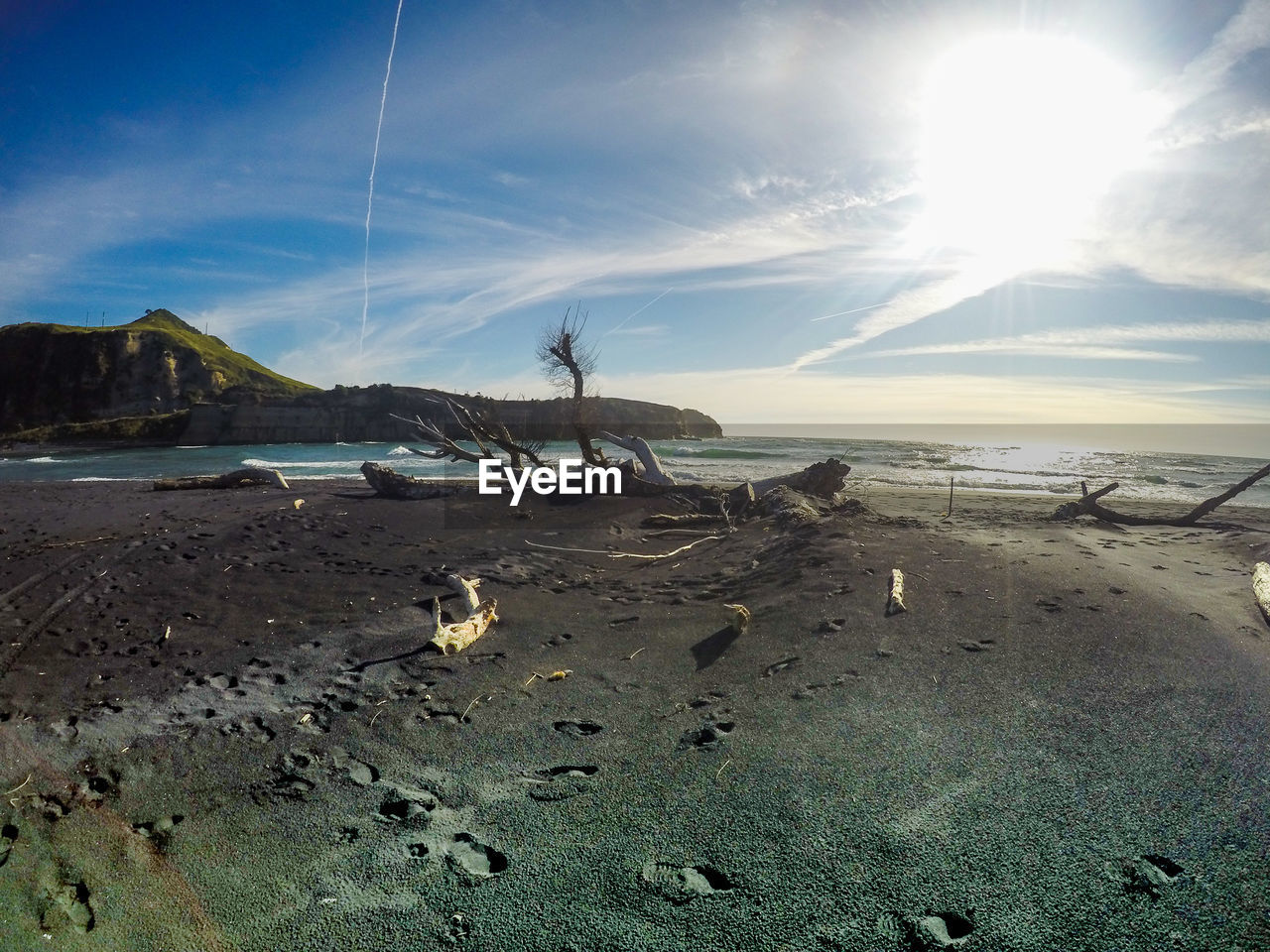 PANORAMIC VIEW OF BEACH AGAINST SKY