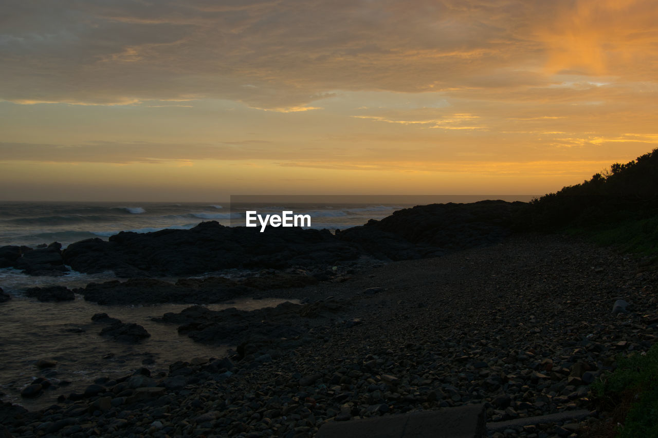Scenic view of sea against sky during sunset