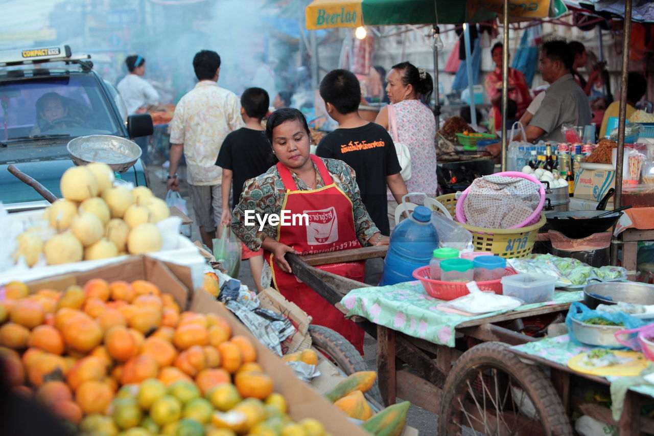 VARIETY OF FOOD FOR SALE AT MARKET STALL