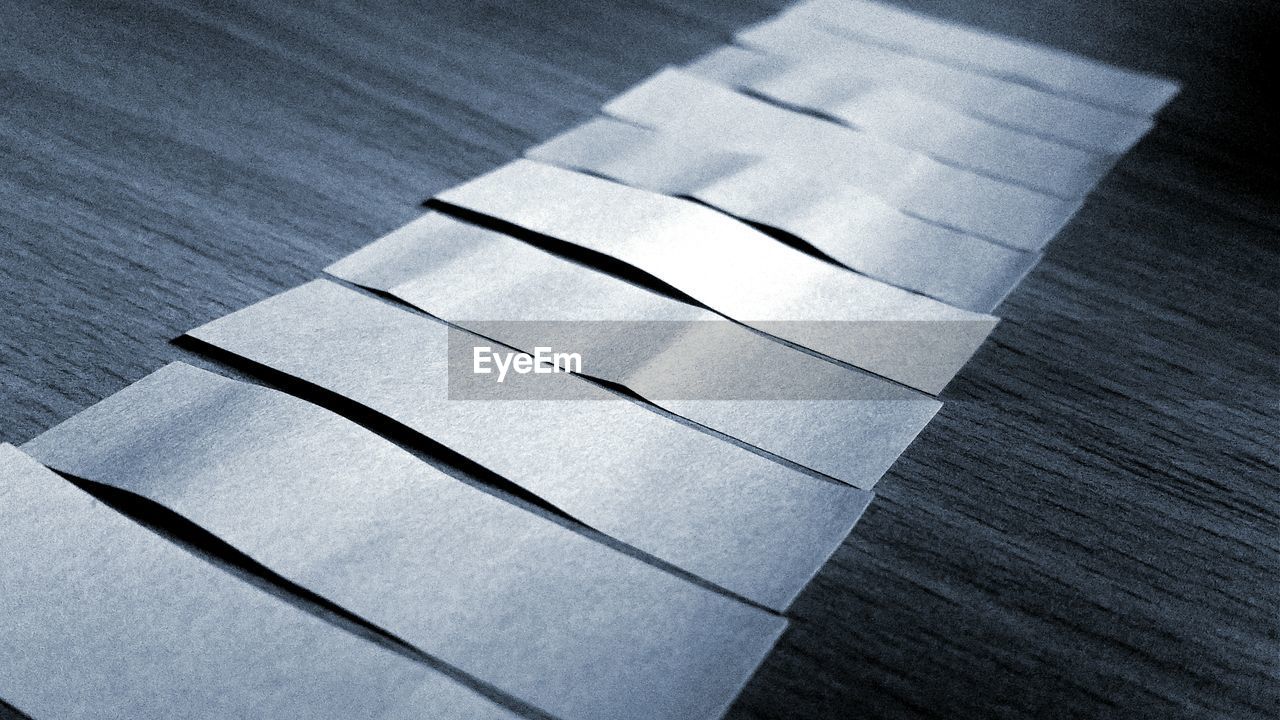 High angle view of papers arranged on table