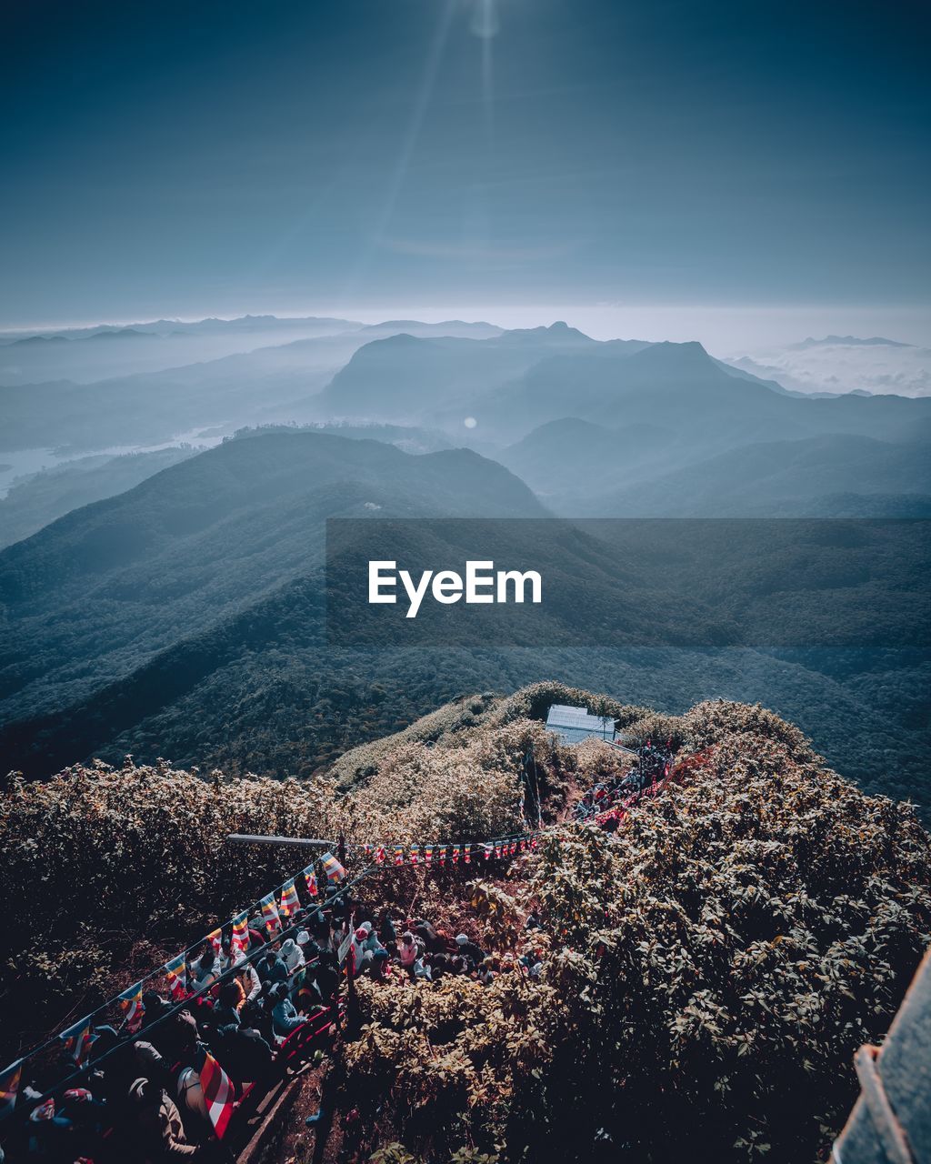 High angle view of crowd on mountain against sky